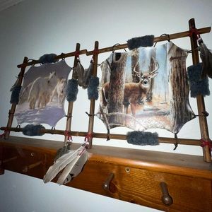 Stretched animal hide with the wolf and a buck hand painted